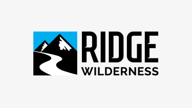 Mountains with a path. Logo for Ridge Wilderness